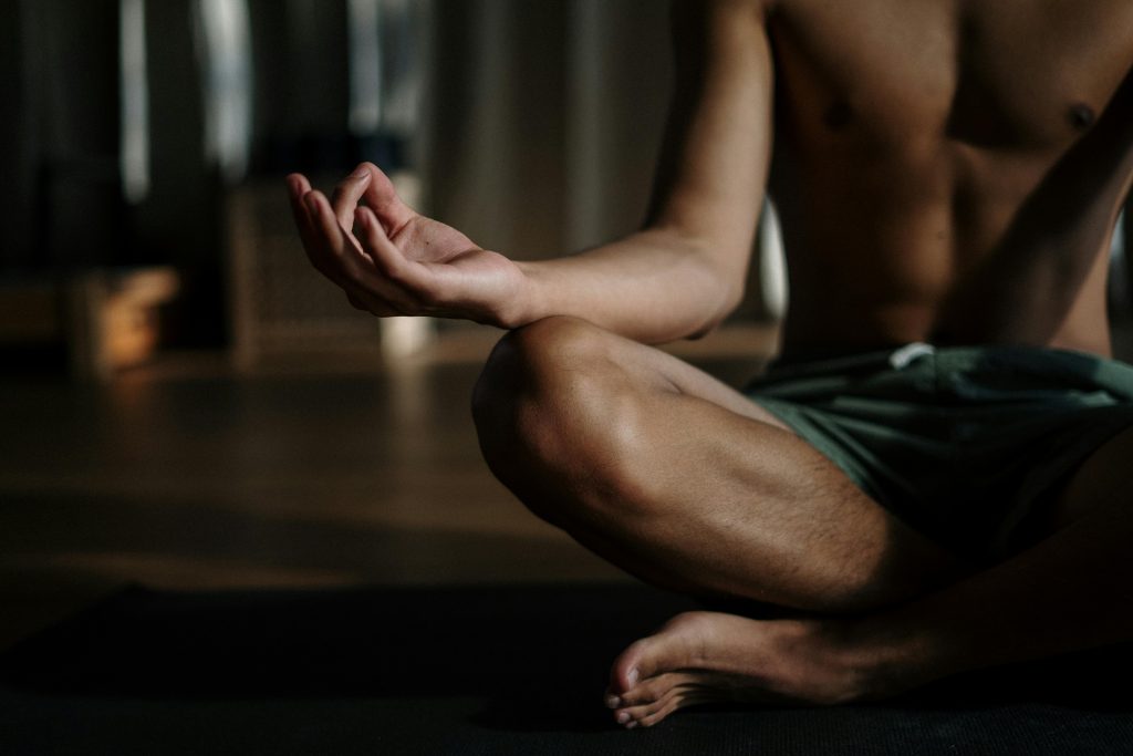 cross legged person deep breathing